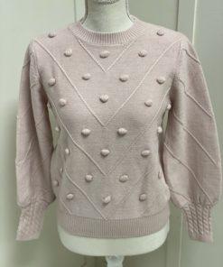 Cozy pink sweater in boutique